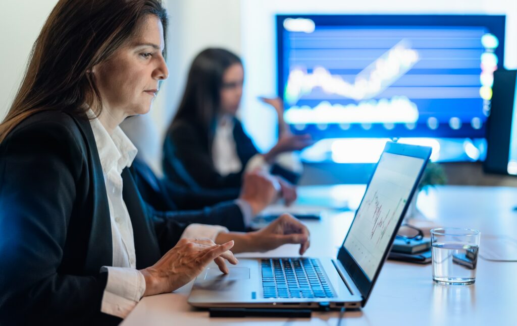 Business stock traders in meeting room working on crypto currency markets with blockchain technology